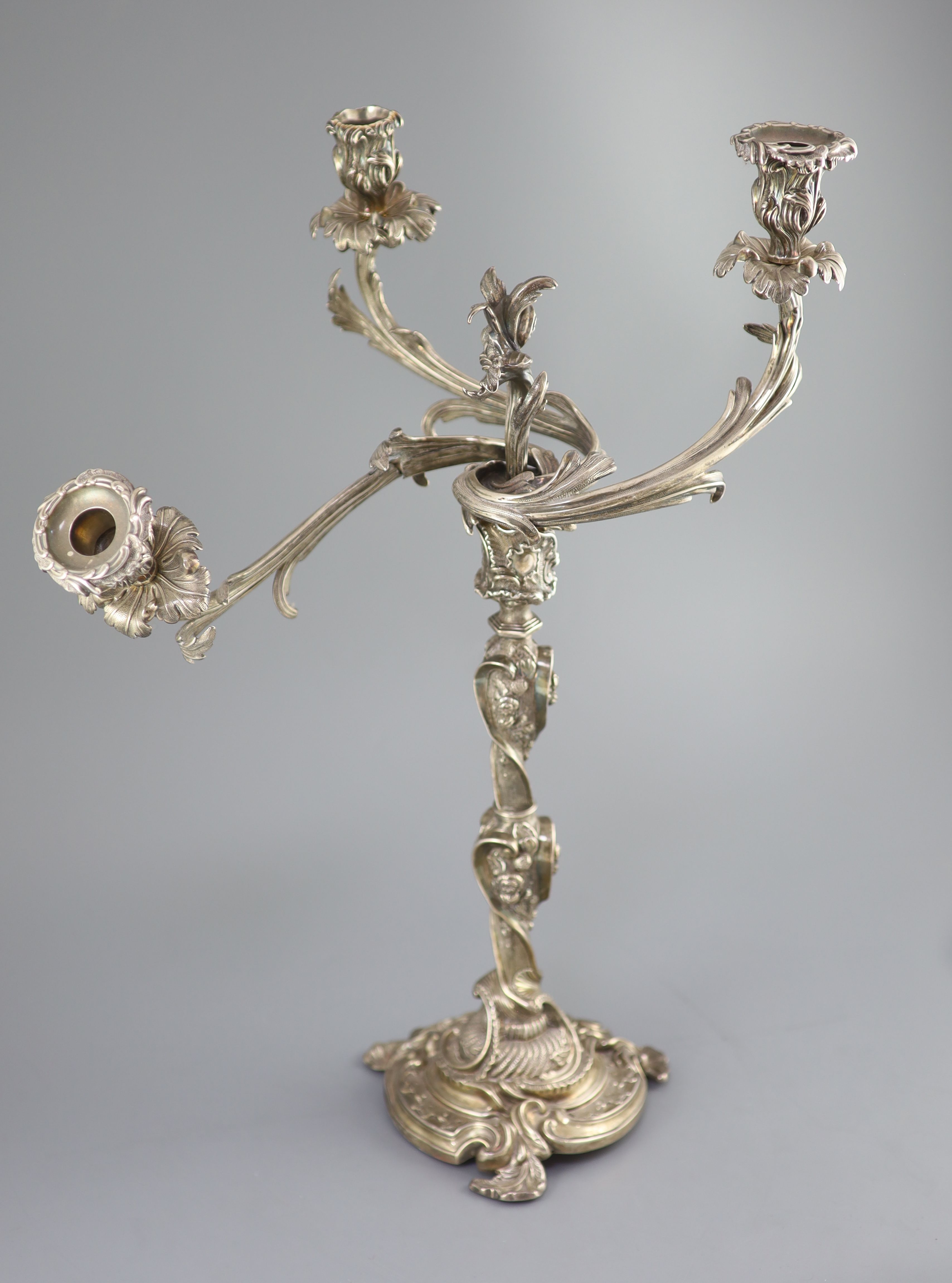 An ornate George III silver three branch, three light candelabrum, by Samuel Roberts, George Cadman & Co (a.f.),